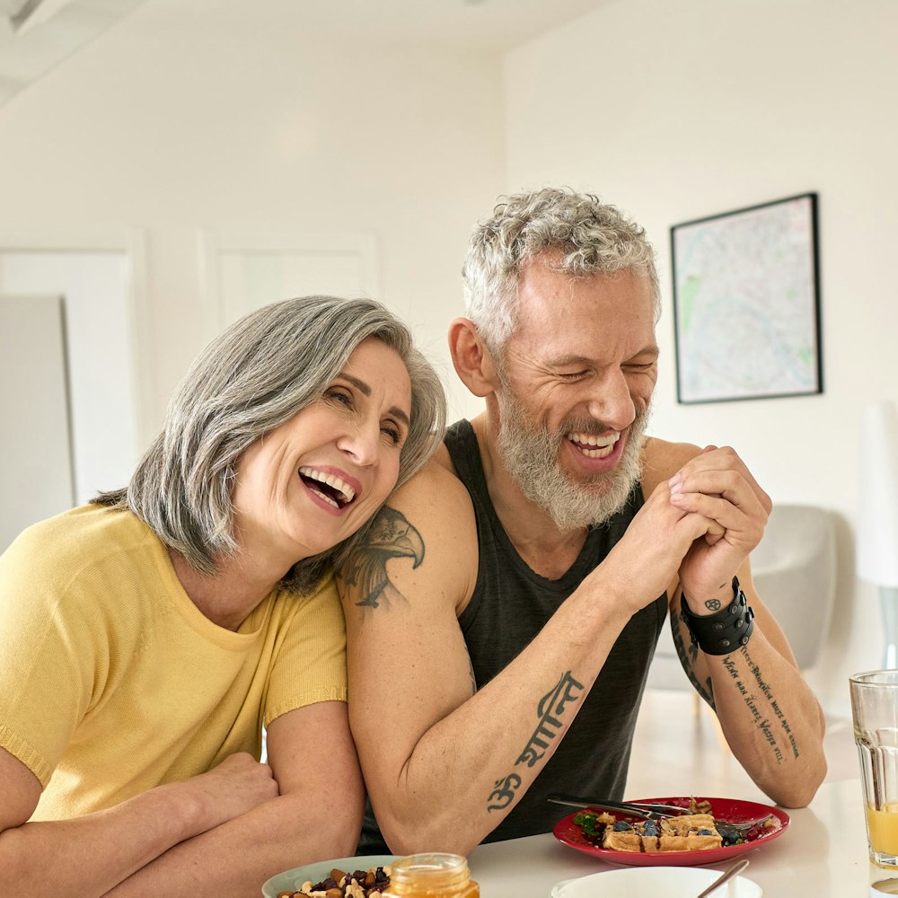 Couple laughing while eating