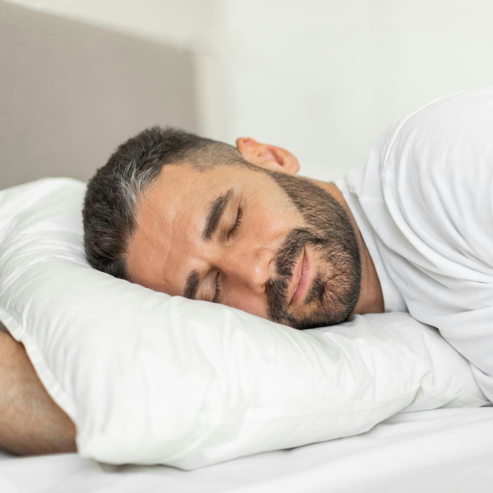 Man lying awake in bed